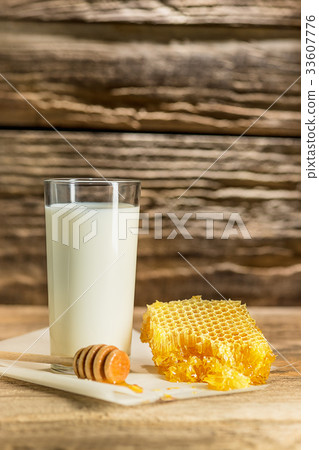 Sweet honeycomb on wooden table Sweet honeycomb on wooden table 33607776