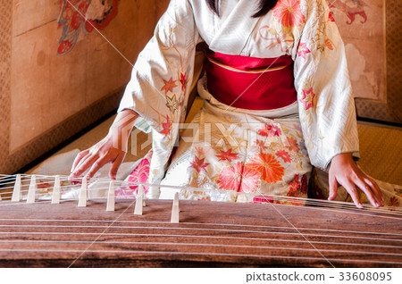 Woman in Kimono dress playing Koto, Japanese harp Woman in Kimono dress playing Koto, Japanese harp 33608095