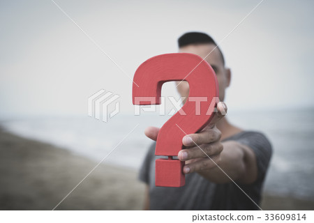 question mark in front of the face of a person 33609814