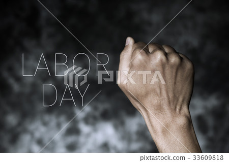 raised fist and text labor day 33609818
