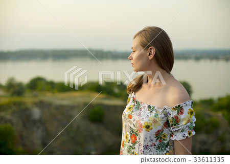 Half length portrait of charming positive woman is 33611335