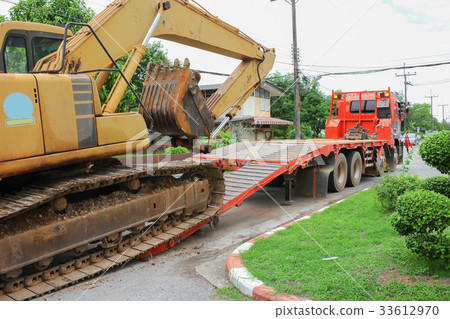 Excavators Moving to a construction site Excavators Moving to a construction site 33612970