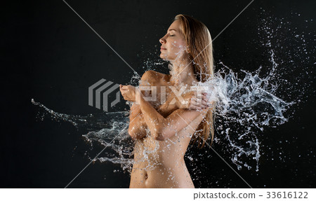 Cropped shot of girl topless in water splashes Cropped shot of girl topless in water splashes 33616122