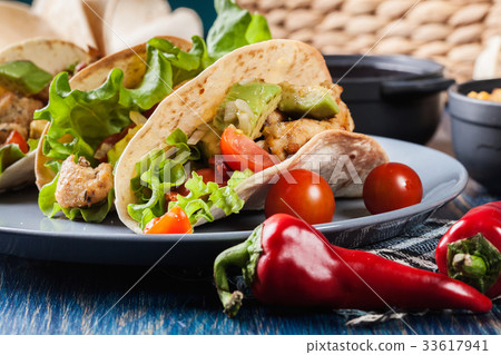 Authentic mexican tacos with chicken and salsa Authentic mexican tacos with chicken and salsa 33617941
