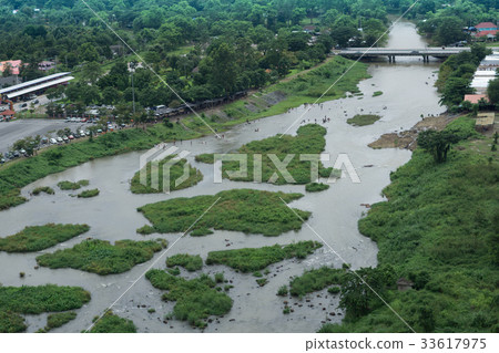 Aerial view of village and river with the forest 33617975