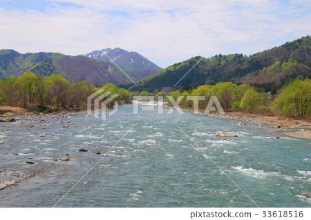 Inan River in spring and mountains with residual snow (Minami Aizu Town) 33618516