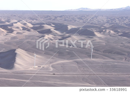 Aerial view of national roads and wind farms running in desert areas near Calama city in northern South America Chile 33618991