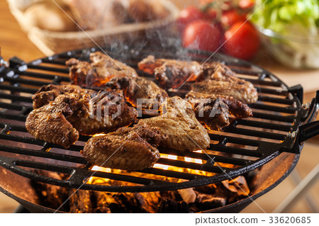 Grilling chicken wings on barbecue grill Grilling chicken wings on barbecue grill 33620685
