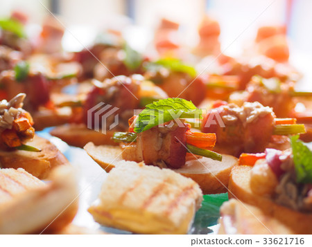 Delicious canapes, bacon snacks and appetizing 33621716
