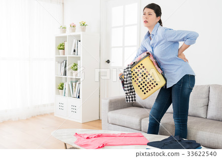 beautiful sweet lady holding messy clothing beautiful sweet lady holding messy clothing 33622540