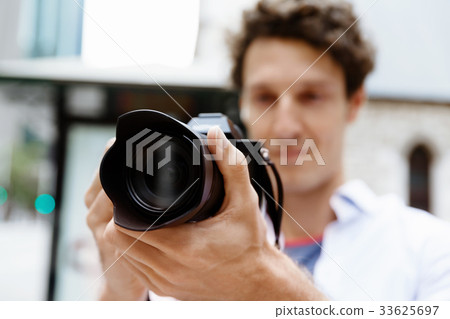 Male photographer taking picture Male photographer taking picture 33625697