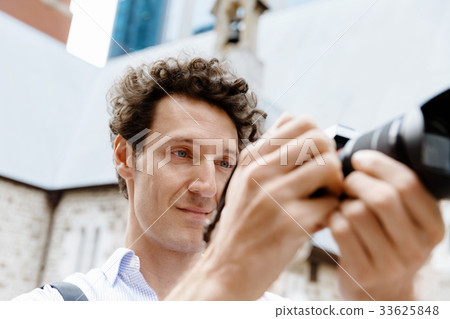Male photographer taking picture Male photographer taking picture 33625848