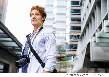 Male tourist in city Male tourist in city 33625909