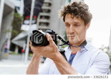 Male photographer taking picture Male photographer taking picture 33626151