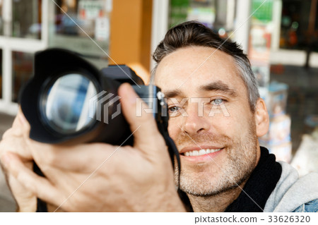 Male photographer taking picture Male photographer taking picture 33626320