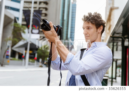 Male photographer taking picture Male photographer taking picture 33626355