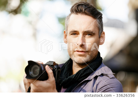 Male photographer taking picture Male photographer taking picture 33626356