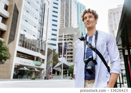 Male tourist in city Male tourist in city 33626423