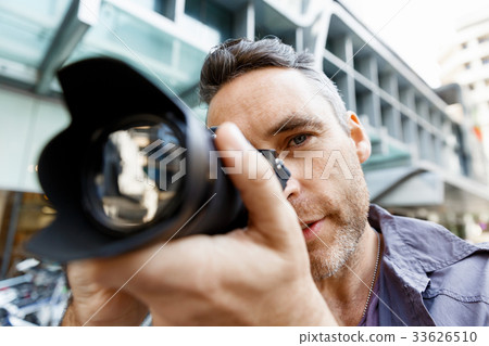Male photographer taking picture Male photographer taking picture 33626510