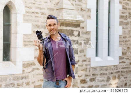 Male photographer taking picture Male photographer taking picture 33626575