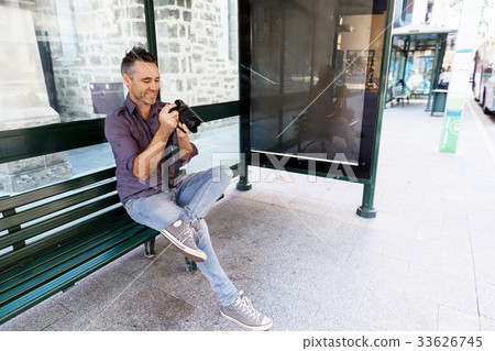 Male photographer taking picture 33626745