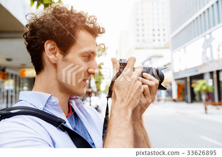 Male photographer taking picture Male photographer taking picture 33626895
