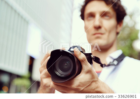 Male photographer taking picture Male photographer taking picture 33626901