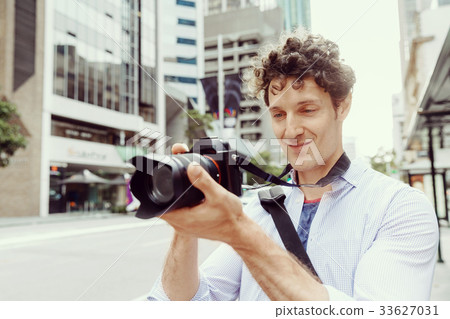 Male photographer taking picture Male photographer taking picture 33627031
