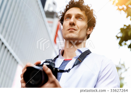 Male photographer taking picture Male photographer taking picture 33627264