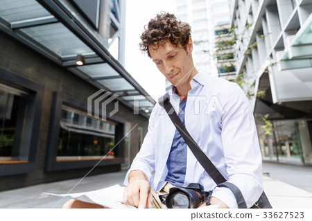 Male tourist in city Male tourist in city 33627523