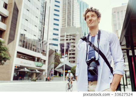 Male tourist in city Male tourist in city 33627524