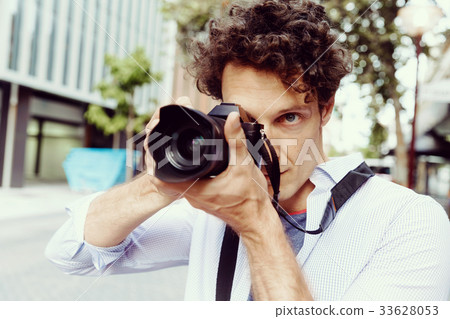 Male photographer taking picture Male photographer taking picture 33628053