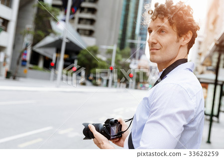 Male photographer taking picture Male photographer taking picture 33628259