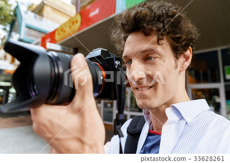 Male photographer taking picture Male photographer taking picture 33628261