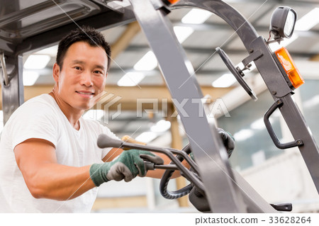 Asian worker in production plant on the factory floor Asian worker in production plant on the factory floor 33628264