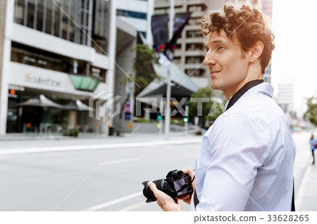 Male photographer taking picture Male photographer taking picture 33628265