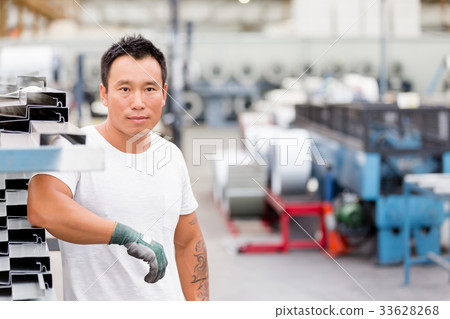 Asian worker in production plant on the factory floor Asian worker in production plant on the factory floor 33628268