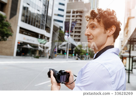 Male photographer taking picture Male photographer taking picture 33628269