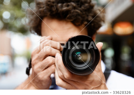 Male photographer taking picture Male photographer taking picture 33628326