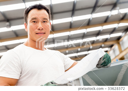 Asian worker in production plant on the factory floor Asian worker in production plant on the factory floor 33628372