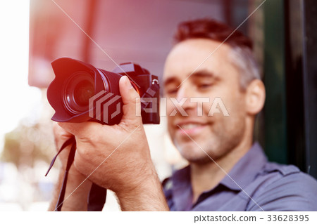 Male photographer taking picture Male photographer taking picture 33628395
