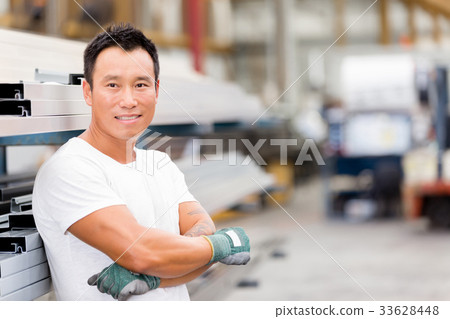 Asian worker in production plant on the factory floor Asian worker in production plant on the factory floor 33628448