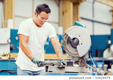 Asian worker in production plant on the factory floor Asian worker in production plant on the factory floor 33628474