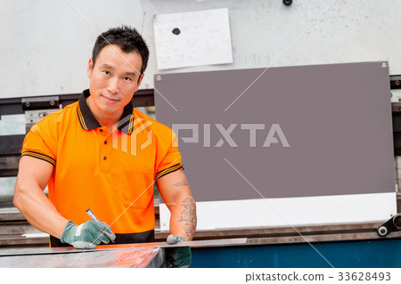 Asian worker in production plant on the factory floor Asian worker in production plant on the factory floor 33628493