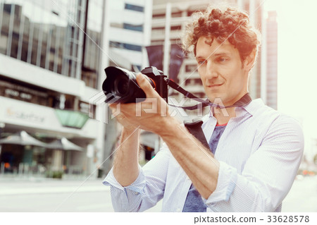 Male photographer taking picture Male photographer taking picture 33628578