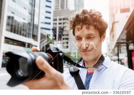 Male photographer taking picture Male photographer taking picture 33628597