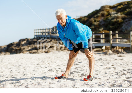 Athlete man tired after long running Athlete man tired after long running 33628674