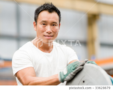 Asian worker in production plant on the factory floor Asian worker in production plant on the factory floor 33628679