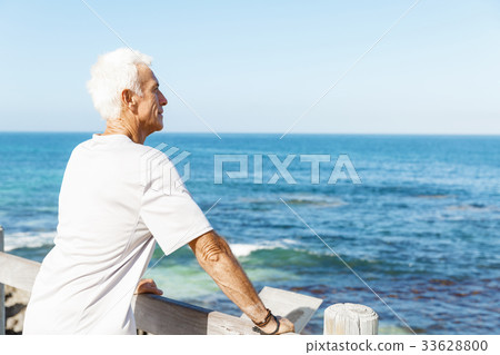 Man standing on beach in sports wear 33628800