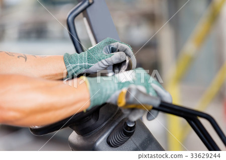 Asian worker in production plant on the factory floor Asian worker in production plant on the factory floor 33629244